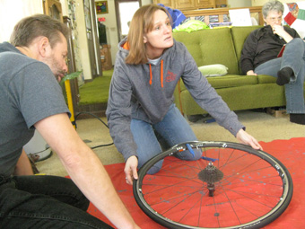 Kathy changes a tire